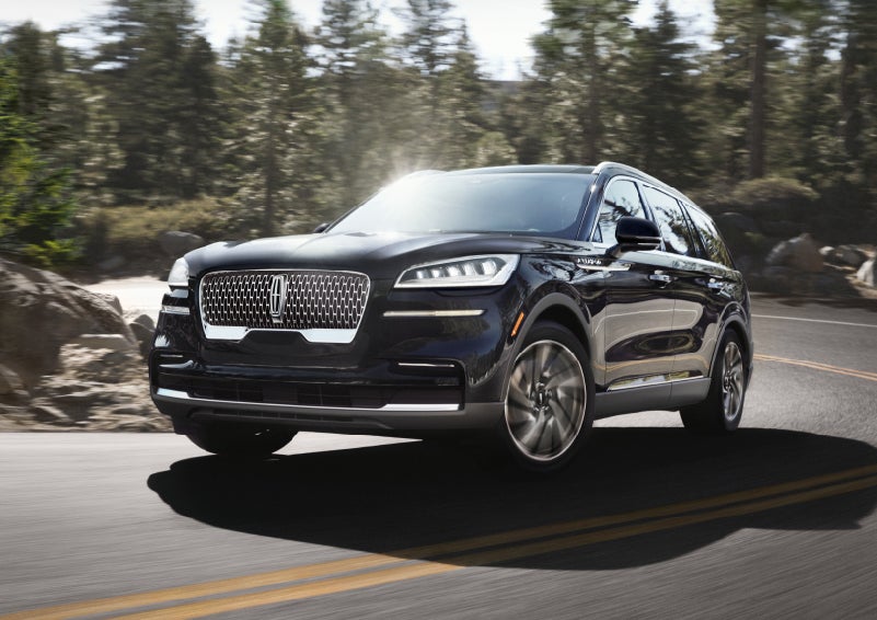 A Lincoln Aviator® SUV is being driven on a winding mountain road | Sheehy Lincoln of Gaithersburg in Gaithersburg MD
