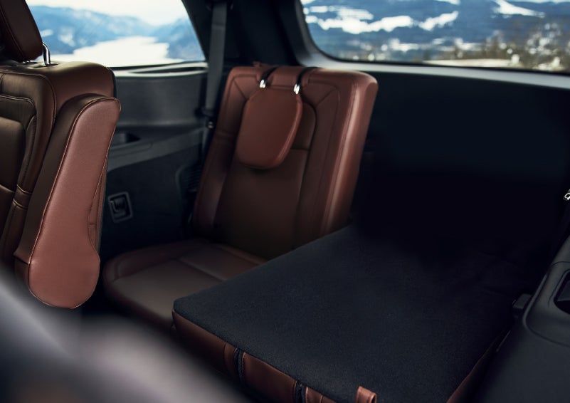 The left rear seat of a 2024 Lincoln Aviator® SUV is shown folded flat for additional cargo space | Sheehy Lincoln of Gaithersburg in Gaithersburg MD