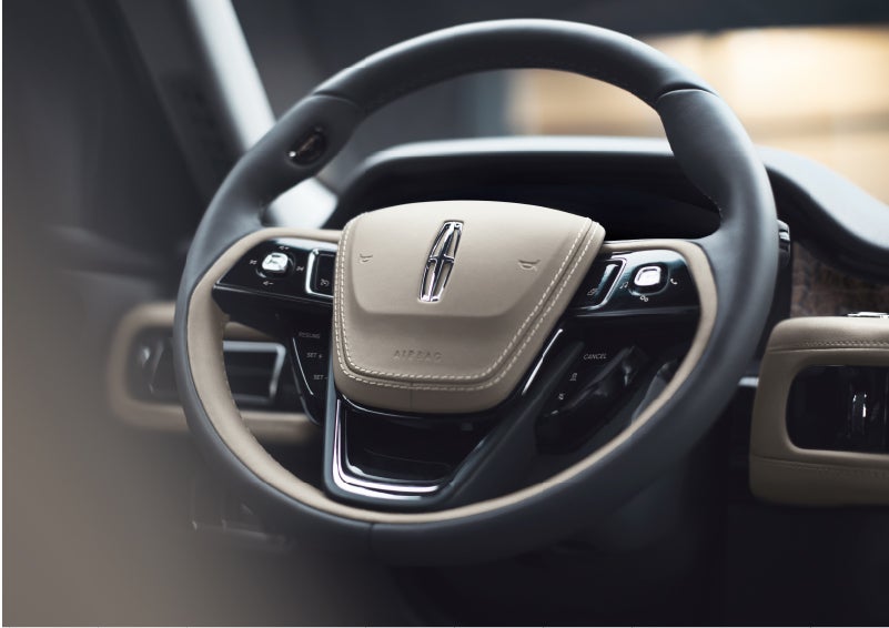 The intuitively placed controls of the steering wheel on a 2023 Lincoln Aviator® SUV | Sheehy Lincoln of Gaithersburg in Gaithersburg MD