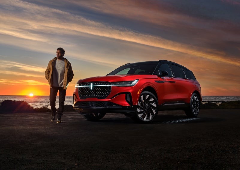 A person is shown next to a 2024 Lincoln Nautilus® SUV as the Lincoln Embrace sequence takes place. | Sheehy Lincoln of Gaithersburg in Gaithersburg MD