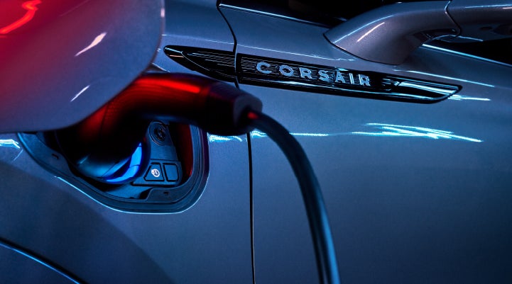 A charger plugged into the charging port of a 2024 Lincoln Corsair® Plug-in Hybrid model. | Sheehy Lincoln of Gaithersburg in Gaithersburg MD
