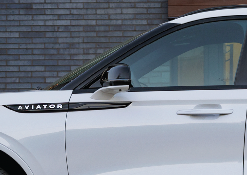 The driver’s door of a white 2025 Lincoln Aviator® SUV is showcased. | Sheehy Lincoln of Gaithersburg in Gaithersburg MD