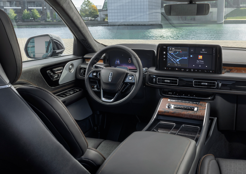 The interior of the 2025 Lincoln Aviator® SUV is shown parked with a view of a harbor through the windshield. | Sheehy Lincoln of Gaithersburg in Gaithersburg MD