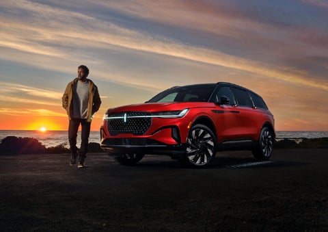 A person is shown next to a 2025 Lincoln Nautilus® SUV as the Lincoln Embrace sequence takes place. | Sheehy Lincoln of Gaithersburg in Gaithersburg MD