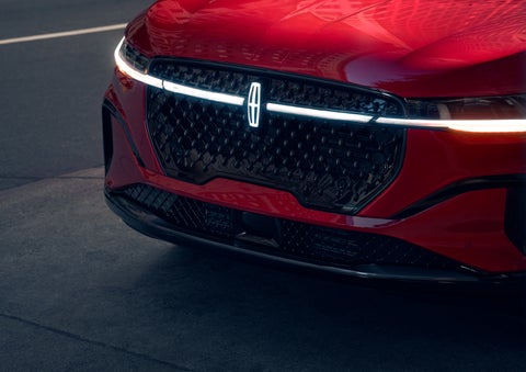 The available front LED light bar and center Lincoln Star logo glow at dusk. | Sheehy Lincoln of Gaithersburg in Gaithersburg MD