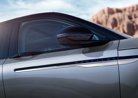 Blue lettering on the side of the vehicle that reads nautilus indicates the available hybrid powertrain. | Sheehy Lincoln of Gaithersburg in Gaithersburg MD