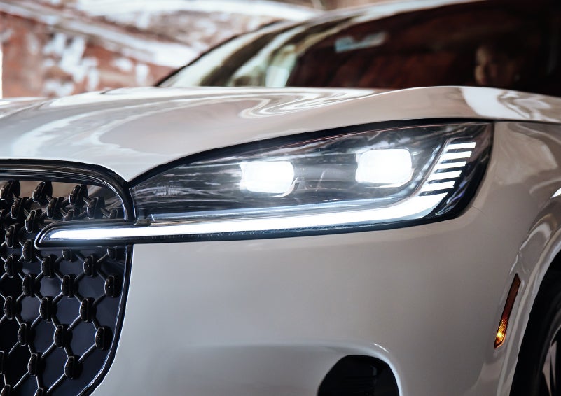 A close-up of a headlamp on the 2026 Lincoln Aviator® SUV is shown. | Sheehy Lincoln of Gaithersburg in Gaithersburg MD