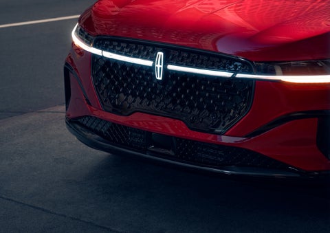 The available front LED light bar and center Lincoln Star logo glow at dusk. | Sheehy Lincoln of Gaithersburg in Gaithersburg MD
