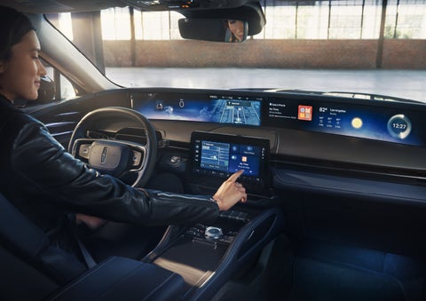 The driver of a 2026 Lincoln Nautilus® SUV interacts with the center touchscreen. | Sheehy Lincoln of Gaithersburg in Gaithersburg MD