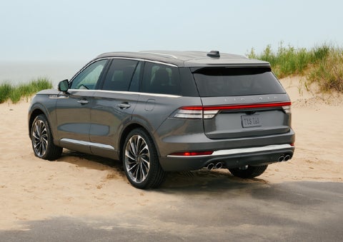 A 2027 Lincoln Aviator® SUV is parked next to sand dunes. | Sheehy Lincoln of Gaithersburg in Gaithersburg MD
