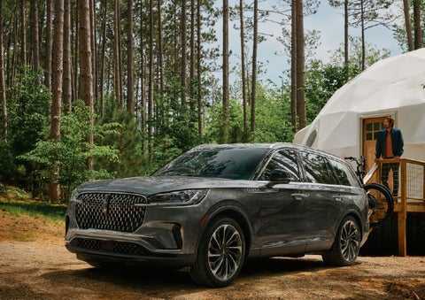 A 2027 Lincoln Aviator® is parked next to a high end glamping site. | Sheehy Lincoln of Gaithersburg in Gaithersburg MD