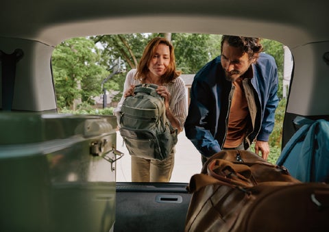 A couple loads luggage into the rear of a 2027 Lincoln Aviator® Black Label™ SUV..e 202 | Sheehy Lincoln of Gaithersburg in Gaithersburg MD